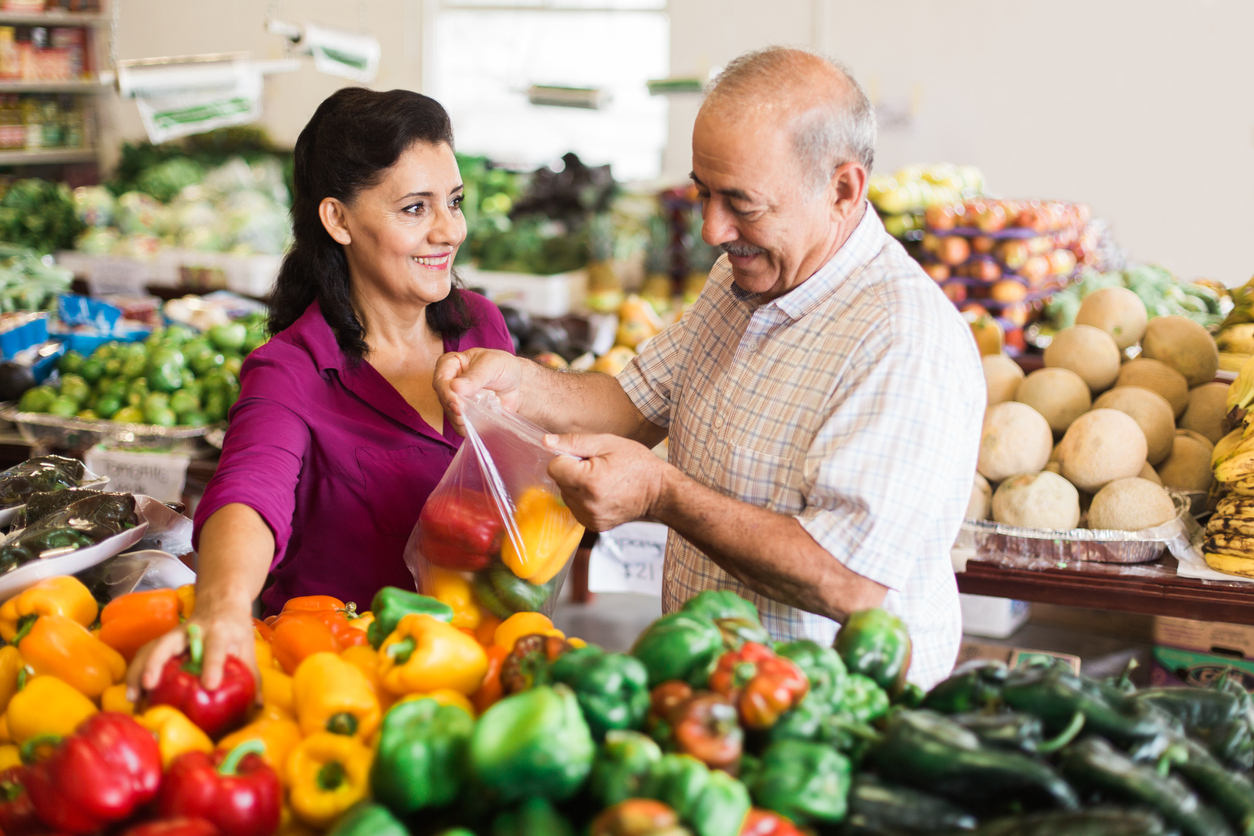 woman and man shopping at supermarket