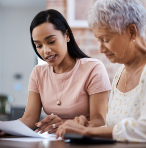 two women reviewing a document