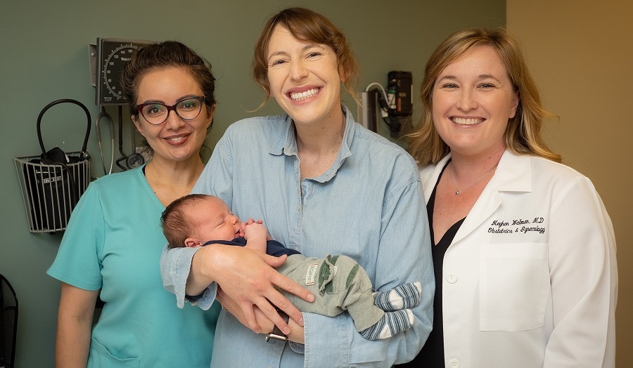 Doctor with woman and new baby