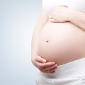 Womanholdingherpregnantstomach