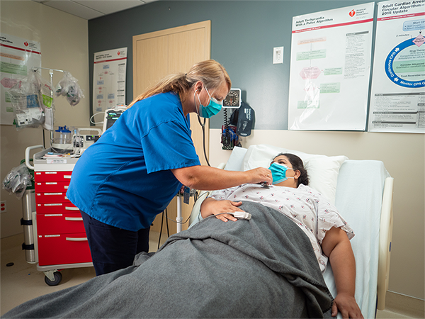 Nurse helps patient