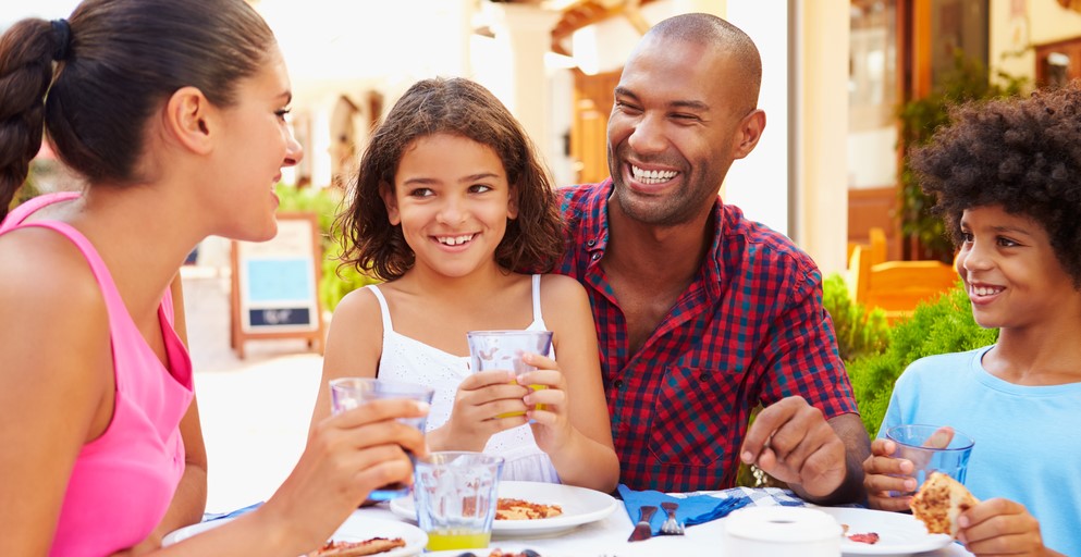 family of four eating diner