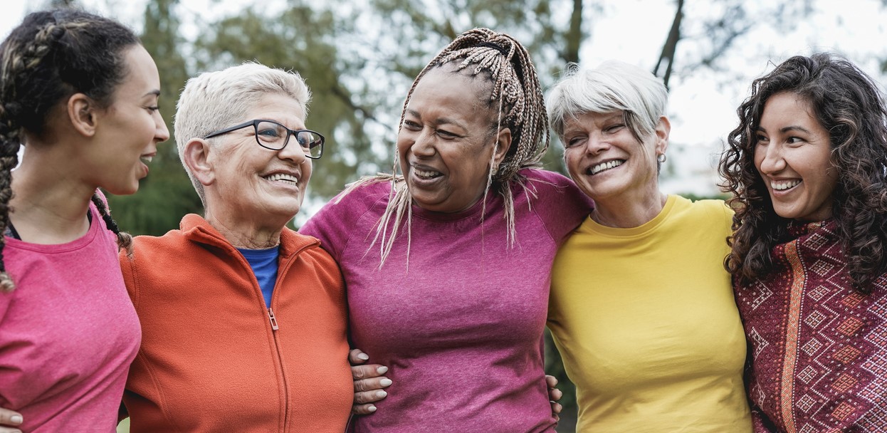 women of all ages hugging