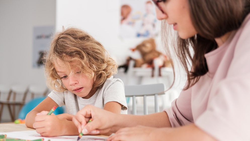 Motherandchildlookingatadrawing