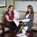 SansumClinicEmployeehelpingapatientatthehealthresourcecenter