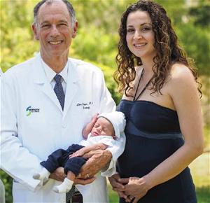 Dr. Koper with new patient Jack and his mother Dr. Koper with new patient Jack and his mother